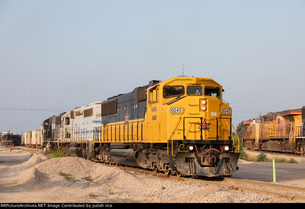 AWRR's 301 job departs Sudduth quarry, with the pair of plant switchers visible in the background